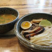 Paitan Tsukemen. · Rich chicken, and fish broth | Soft boiled egg | Yuzu Zest | Scallion | Lime | Thick noodles