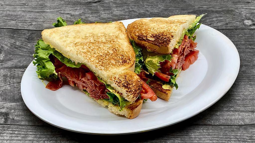 Salami L & T · Thinly Sliced Salami slightly Grilled, on White Toast with our New Signature Roasters Mayo, Lettuce, and Tomatoes.
