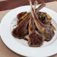 Scottadito · Grilled lamb chops served with artichokes, fingerling potatoes, and 12-year aged Bonini bals...