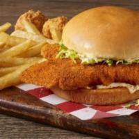 Catfish Sandwich & Fries · Two well seasoned hand-breaded catfish fillets served on a toasted bun with tangy tartar sau...