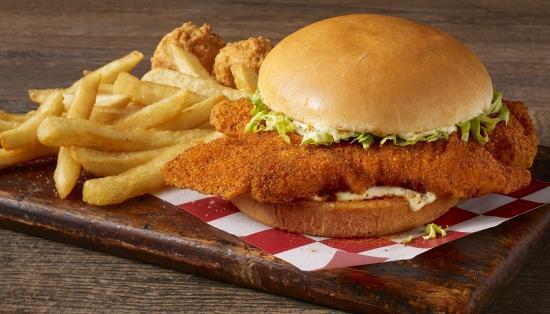 Catfish Sandwich & Fries · Two well seasoned hand-breaded catfish fillets served on a toasted bun with tangy tartar sauce, lettuce and a touch of Cajun seasoning. Served with Fries & two hush puppies.