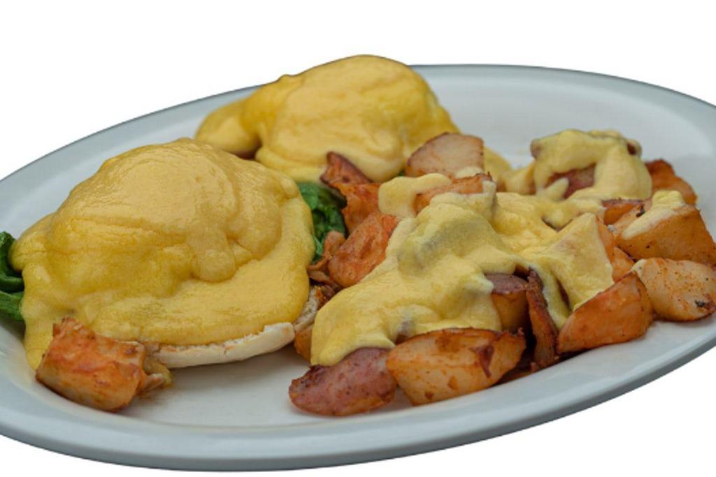 Eggs Benedict · Canadian bacon on a toasted English muffin, topped with two poached eggs and hollandaise sauce.