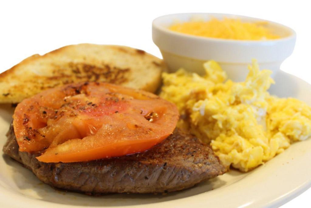 Steak & Eggs · Two eggs, 6 oz. sirloin steak, grilled tomato and garlic toast, with choice of home fries or grits.