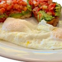 Avocado Toast & Eggs · Toasted Tuscan bread, smashed avocado and fresh picante salsa served with two eggs.