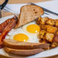 The Classic · Two eggs, bacon or sausage, toast, and choice of home fries or grits.. Substitute country ha...
