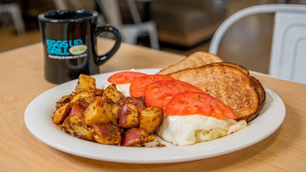 Goodness Gracious · Egg white omelet with spinach, onions, mushrooms and feta cheese topped with sliced tomatoes.. Add turkey bacon.