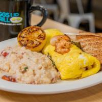 Shrimp & Grits Omelet · Shrimp, andouille sausage, green peppers, sautéed onions, and Swiss cheese omelet served wit...