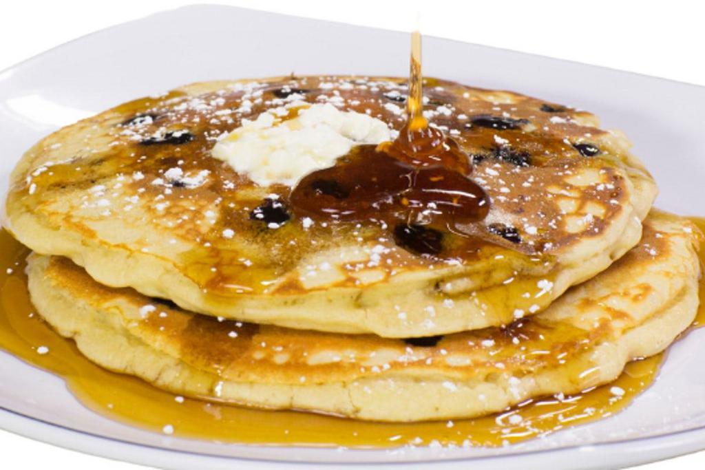 2 Buttermilk Pancakes · Two buttermilk pancakes sprinkled with powdered sugar.. Add chocolate chips, blueberries, bananas, praline pecans or granola.