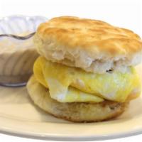 Biscuit-Wich · Sausage patty, egg and cheddar cheese on a grilled biscuit with sausage gravy on the side fo...