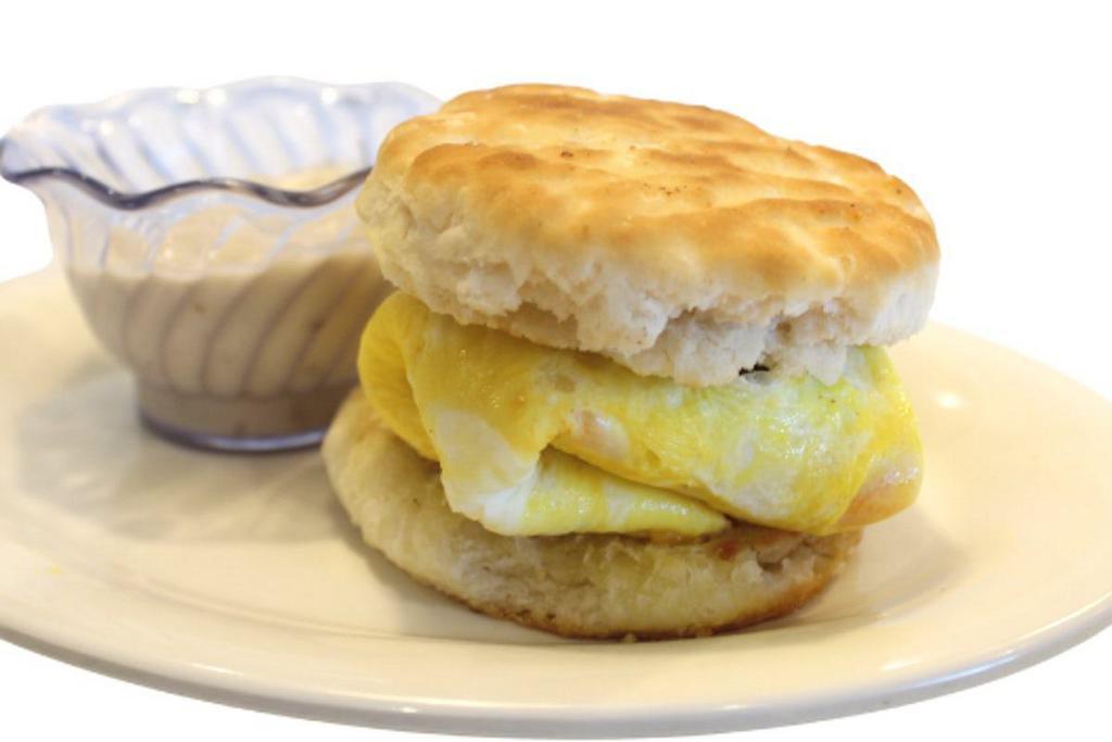 Biscuit-Wich · Sausage patty, egg and cheddar cheese on a grilled biscuit with sausage gravy on the side for dipping.