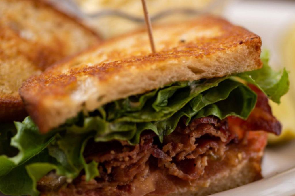 Blt · Five strips of bacon, lettuce, tomato and mayo on grilled Tuscan bread.