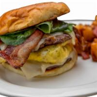 Good Morning Burger · A steak burger stacked with a mushroom and onion omelet, Swiss cheese, crispy bacon, and fre...