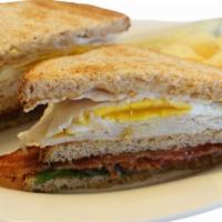 The Club · Turkey, egg, bacon, lettuce, tomatoes and mayo served on wheat toast.