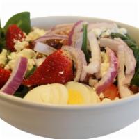 Spinach Salad · Spinach, boiled egg, fresh strawberries, praline pecans, red onions and feta cheese tossed w...