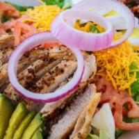 Cobb Salad · Mixed greens, bacon, avocado, red onions, tomato, boiled egg, grilled chicken breast, and ch...