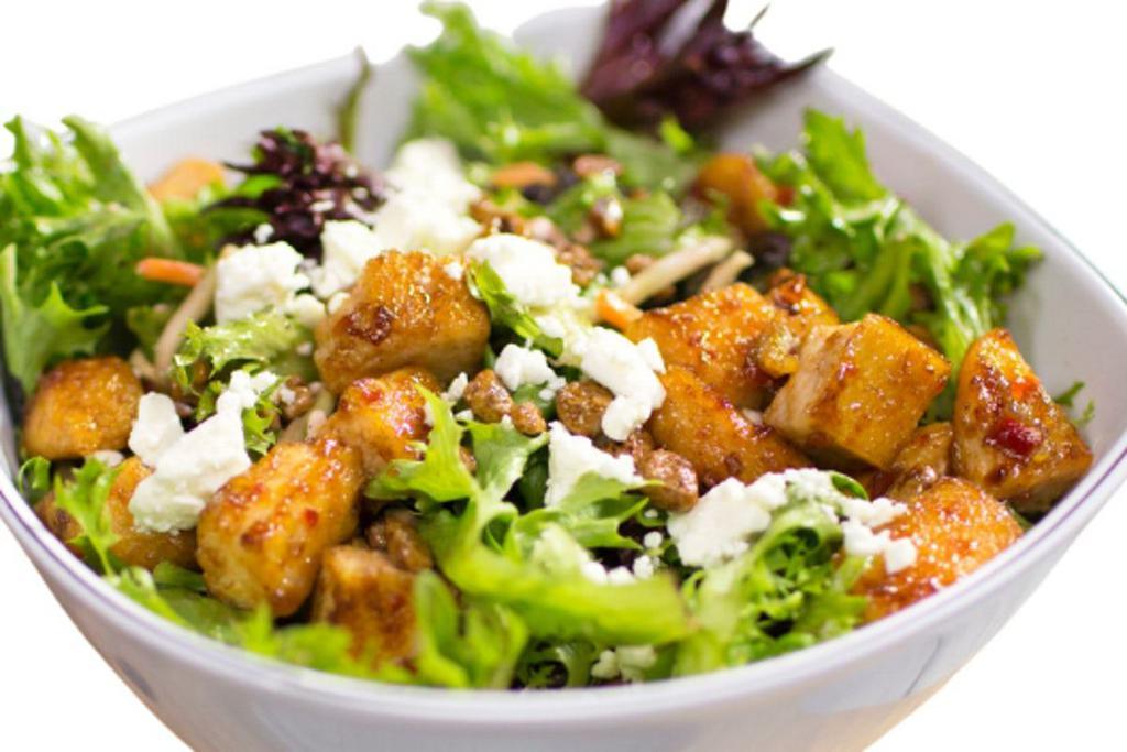 Praline Pecan Chicken · Diced chicken breast and mixed greens tossed in Blueberry Pomegranate dressing with praline pecans and feta cheese crumbles.