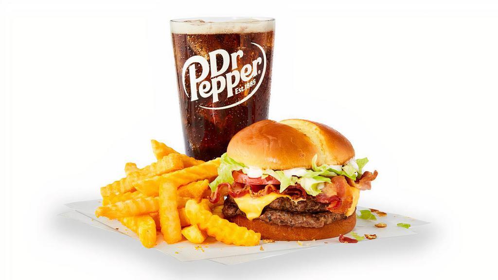 Big Bacon Combo · Two big, juicy, all-beef patties stacked with shredded lettuce, sliced tomato, American cheese, two slices of crispy bacon, and mayo on a toasted premium artisan bun. Served with fries and a drink.