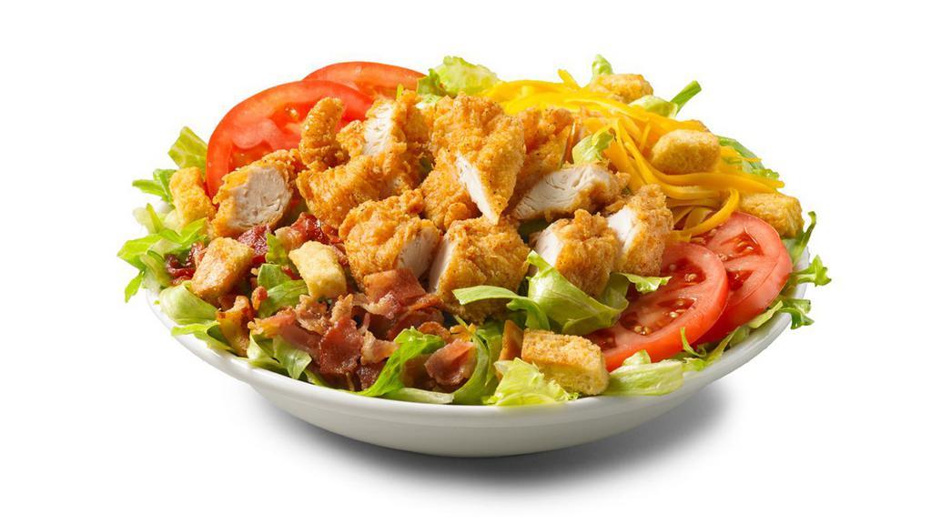 Crispy Chicken Blt Salad · All the delicious tastes of a BLT, without the bread. Fried chicken, lettuce, sliced tomatoes, shredded cheddar, croutons and the most important ingredient, crispy crumbled bacon. Served with your choice of dressing.
