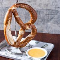 The Giant Pretzel · Warm bavarian soft pretzel, and creamy beer cheese sauce.