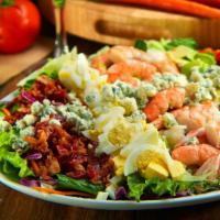 Shrimp Cobb Salad · Poached jumbo shrimp, avocado, applewood smoked bacon, crumbled blue cheese, vine-ripened to...