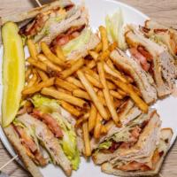 Triple Decker Turkey Club · Oven roasted turkey breast, applewood smoked bacon, vine ripened tomaton, hand leafed lettuc...