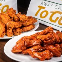 Traditional Jumbo Wings  (25 Pcs) · Hand-breaded or “naked”, tossed in choice of