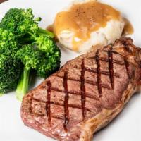 New York Strip Steak · 12oz USDA Choice center-cut aged 28 days. Includes choice of two sides.
