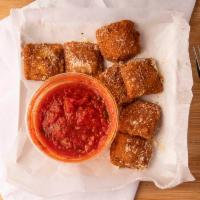 Fried Ravioli · Deep fried, filled with cheese and served with marinara sauce for dipping.