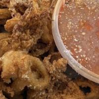 Fried Calamari · Tender calamari dredged in seasoned flour and flash fried. Served with a fra diavolo sauce.