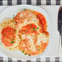 Chicken Parmigiana · Lightly fried chicken breast smothered in fresh tomato sauce. Baked with Parmigiano and Mozz...