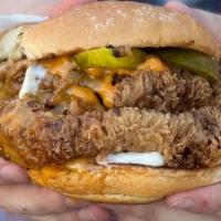 The Cluckster · Our delicious take on a chicken sandwich made w- a pile of crispy fried lion’s mane mushroom...