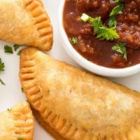 Classic Empanadas · Atlanta's best homemade crispy mat turnovers served with a specialty tomatillo sauce.
