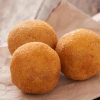 Arancini · Crispy deep fried balls of rice made up of mozzarella cheese filling and a crunchy breadcrum...