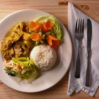 Curry Chicken · Served with rice and peas or white rice, salad, and plantains.