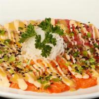 Carpaccio · Thin slices of salmon, white fish or tuna with spicy mayo, house sauce, truffle oil and sesa...