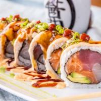 Monster Trio House Roll · Tuna, white fish, salmon, tempura avocado, scallions, eel sauce, spicy mayo and Sriracha.