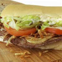 Steak Sandwich · Palomilla Steak, Our Famous Crispy String Fries and Grilled Onions.