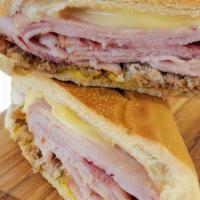 Cuban Sandwich · Roasted Pork, Smoked Ham, Swiss Cheese, Pickles, and Mustard.