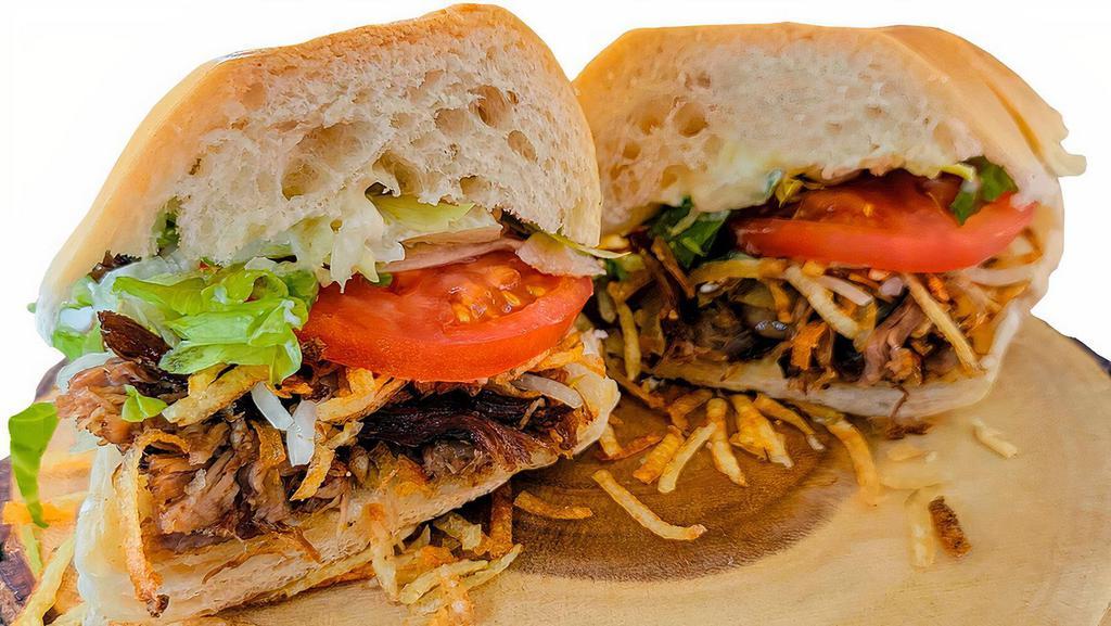 Shredded Steak Sandwich (Vaca Frita) · Pan-Seared Shredded Flank Steak, Our Famous Crispy String Fries and Grilled Onions.