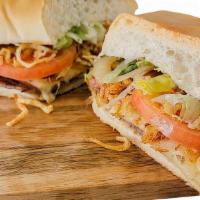 Cuban Guys Sandwich · Our Signature Palomilla Steak, Ham, Swiss Cheese Sandwich, With Our Famous Crispy String Fri...