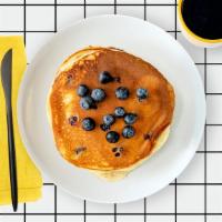 Labc Blueberry Pancakes · Two fluffy pancakes with blueberries served with a side of butter and syrup. Stack.It.Up.