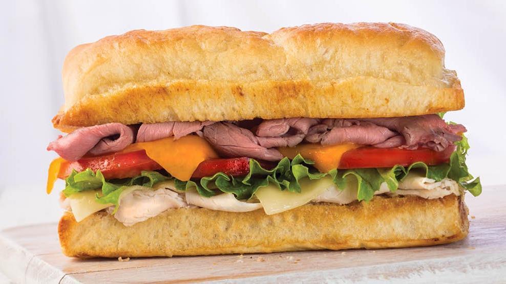 Montagu® · Roasted beef, turkey, Swiss, cheddar, lettuce, Roma tomato & Earl’s mustard sauce. 730 cal per person
