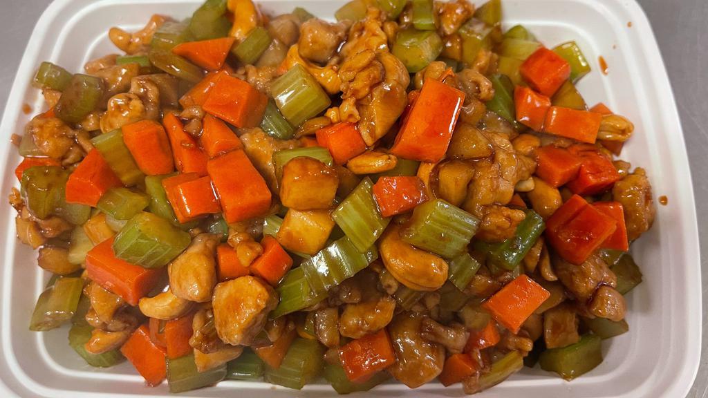 Chicken With Cashew Nuts 腰果鸡 · Diced chicken sautéed with crispy cashew, nuts, waterchestnuts, bamboo shoots in brown sauce.