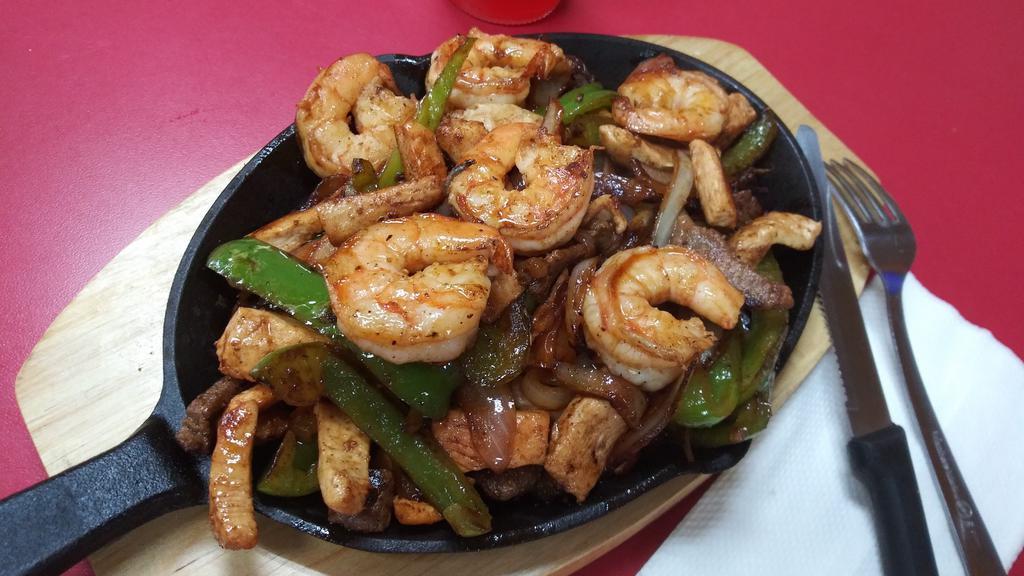Fajita Texana · Comes with steak, shrimp, chicken, mix of vegetables, bell peppers, onions, tomatoes, accompanied with beans, rice,
Salad and corn tortillas.