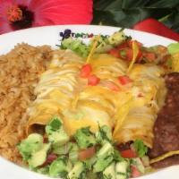 Enchiladas De Pollo · Shredded Chicken enchiladas with choice of sauce, green or red, served with rice, beans, che...