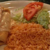 Chimichanga · One beef tips or chicken chimichanga deep fried topped with nacho cheese. Served with beans,...
