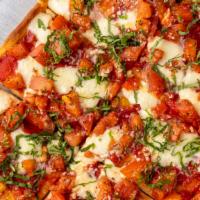 Bruschetta Pizza · Fresh mozzarella, tomato, e.v.o.o basil and spices on bruschetta crust.