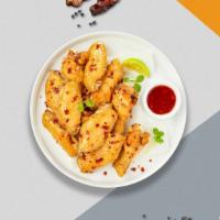 Just Chili Mango Wings · Fresh chicken wings breaded, fried until golden brown, and tossed in our mango chili sauce. ...