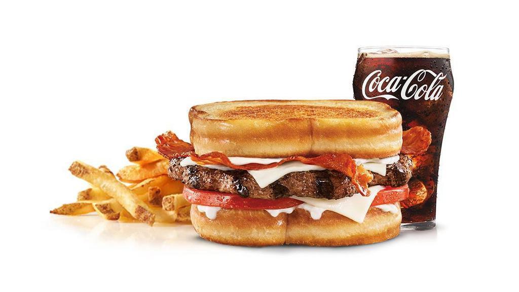 Frisco Angus Burger Combo · Charbroiled Third Pound 100% black angus beef patty, crispy bacon, melted Swiss cheese, tomato, and mayonnaise, served on toasted sourdough. Served with Fries and a Beverage.