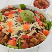 Taco Salad · Vegetarian chili, romaine, tomato, avocado, Cheddar, sour cream, salsa with tortilla strips....